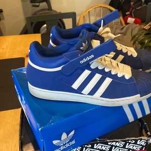 Shell toe high tops.